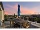 Private rooftop deck with city views and dining area at 669 N Washington St # 901, Denver, CO 80203