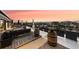 Private rooftop deck with city views and comfortable seating at 669 N Washington St # 901, Denver, CO 80203