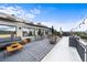 Relaxing rooftop deck with seating area and dining furniture, offering city views at 669 N Washington St # 901, Denver, CO 80203