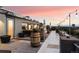 Private rooftop deck with city views and dining area at 669 N Washington St # 901, Denver, CO 80203
