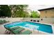 Community pool with lounge chairs for relaxing at 669 N Washington St # 901, Denver, CO 80203