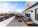 Spacious rooftop deck with sectional sofa, umbrella, and city views at 669 N Washington St # 901, Denver, CO 80203