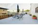 Private patio with table, chairs, and umbrella at 669 N Washington St # 901, Denver, CO 80203
