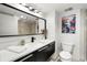 Clean bathroom with a single vanity and a toilet at 669 N Washington St # 901, Denver, CO 80203