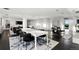Modern dining area with a large table and chairs, and access to other rooms at 669 N Washington St # 901, Denver, CO 80203