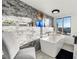 Relaxing bathroom with a freestanding tub and city view at 669 N Washington St # 901, Denver, CO 80203