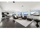 Spacious living room with city views, dark hardwood floors, and comfortable seating at 669 N Washington St # 901, Denver, CO 80203