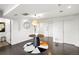 Modern entryway with dark hardwood floors, a round table, and elevator access at 669 N Washington St # 901, Denver, CO 80203