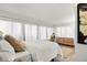 Bright bedroom with a king-size bed and ample natural light at 669 N Washington St # 901, Denver, CO 80203