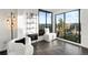 Bright living room with floor to ceiling windows, city views and access to balcony at 669 N Washington St # 901, Denver, CO 80203