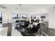 Open living room features hardwood floors, city views, and ample natural light at 669 N Washington St # 901, Denver, CO 80203