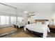 Spacious bedroom with mirrored closet and a queen-size bed at 669 N Washington St # 901, Denver, CO 80203