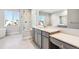 Primary bathroom with glass shower, vanity, and soaking tub at 1737 Marlowe E Cir, Erie, CO 80516