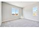 Bedroom with plush carpeting, large windows, and mountain views at 1737 Marlowe E Cir, Erie, CO 80516