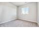 Vacant bedroom with plush carpet and ample natural light at 1737 Marlowe E Cir, Erie, CO 80516