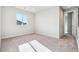 Empty bedroom with carpet flooring and large window at 1737 Marlowe E Cir, Erie, CO 80516