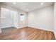 Bright entryway with wood-look flooring and view of staircase at 1737 Marlowe E Cir, Erie, CO 80516