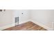 Laundry room with wood-style flooring and utility connections at 1737 Marlowe E Cir, Erie, CO 80516