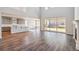 Open plan living area with kitchen, dining, and living room at 1737 Marlowe E Cir, Erie, CO 80516