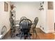 Dining area with a dark wood table and four black chairs at 10001 E Evans Ave # 74B, Aurora, CO 80247