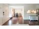 Bright dining area with four chairs and a view into the kitchen at 10001 E Evans Ave # 74B, Aurora, CO 80247