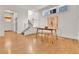 Elegant dining area with hardwood floors and a modern dining set at 9045 E 58Th Dr, Denver, CO 80238