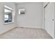 Well-lit bedroom with carpet, window, and built-in shelving at 9045 E 58Th Dr, Denver, CO 80238