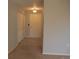 Bright entryway with neutral walls, tile flooring, and double closets at 2894 W Riverwalk Cir # B219, Littleton, CO 80123