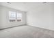 Spacious bedroom with grey carpet and dual windows overlooking neighborhood views at 4369 Hickory Oaks St, Castle Rock, CO 80104