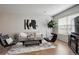 Modern living room with neutral tones and large windows at 10473 Paris St # 305, Commerce City, CO 80640