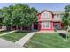 Two-story home with landscaping and inviting front porch at 10473 Paris St # 305, Commerce City, CO 80640