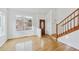 Bright entryway with hardwood floors, staircase, and neutral walls at 4050 E 133Rd Cir, Thornton, CO 80241