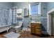 Bathroom with a bathtub, toilet, and vanity at 1520 S Acoma St, Denver, CO 80223