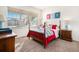 Bright bedroom with a double bed, nightstands and window at 8235 S Shawnee St, Aurora, CO 80016