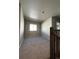 Upstairs loft area with carpet and neutral colored walls at 183 Mt Bierstadt St, Brighton, CO 80601