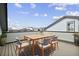 Spacious rooftop deck with outdoor dining furniture and city views at 1739 W 166Th Ave, Broomfield, CO 80023