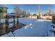 Large backyard with gazebo, shed, and snow-covered lawn at 5224 Mt Arapaho Cir, Frederick, CO 80504