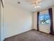 Bright bedroom featuring a window with natural light and plush carpeting at 5224 Mt Arapaho Cir, Frederick, CO 80504