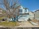 Two-story house with blue accents, attached garage, and a well-maintained lawn at 5224 Mt Arapaho Cir, Frederick, CO 80504