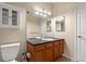 Double vanity bathroom with granite countertop and updated fixtures at 9180 Rolling Way # 302, Parker, CO 80134