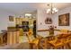 Dining area with wood table and chairs, view into kitchen at 405 Four Oclock Rd # 13A, Breckenridge, CO 80424