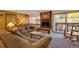 Living room with fireplace, couches, and access to balcony at 405 Four Oclock Rd # 13A, Breckenridge, CO 80424