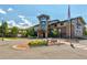 Exterior view of two-story building with stone accents at 14215 E Marina Dr, Aurora, CO 80014