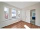 Bright bedroom with hardwood floors and bay windows at 1417 Monroe St, Denver, CO 80206