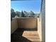 Private balcony with wooden deck and a view of neighboring buildings at 467 S Memphis Way # 17, Aurora, CO 80017