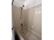 Bathroom featuring a shower/tub combo and tiled walls at 467 S Memphis Way # 17, Aurora, CO 80017