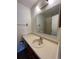 Bathroom vanity with a single sink and a large mirror at 467 S Memphis Way # 17, Aurora, CO 80017