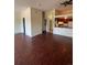 Open living room with kitchen views and dark laminate flooring at 467 S Memphis Way # 17, Aurora, CO 80017