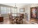 Dining room featuring hardwood floors, wood table and chairs at 11785 W 66Th Pl # A, Arvada, CO 80004