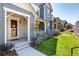 Two-story home with gray and beige siding, landscaping, and a porch at 3344 Emily St, Castle Rock, CO 80109